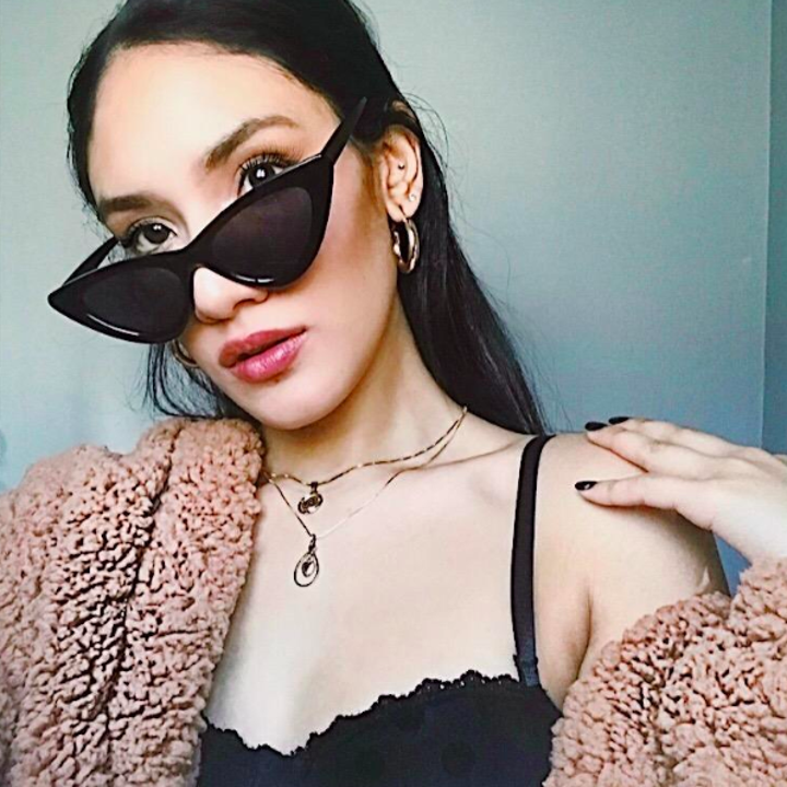 reviewer wears triangle shades