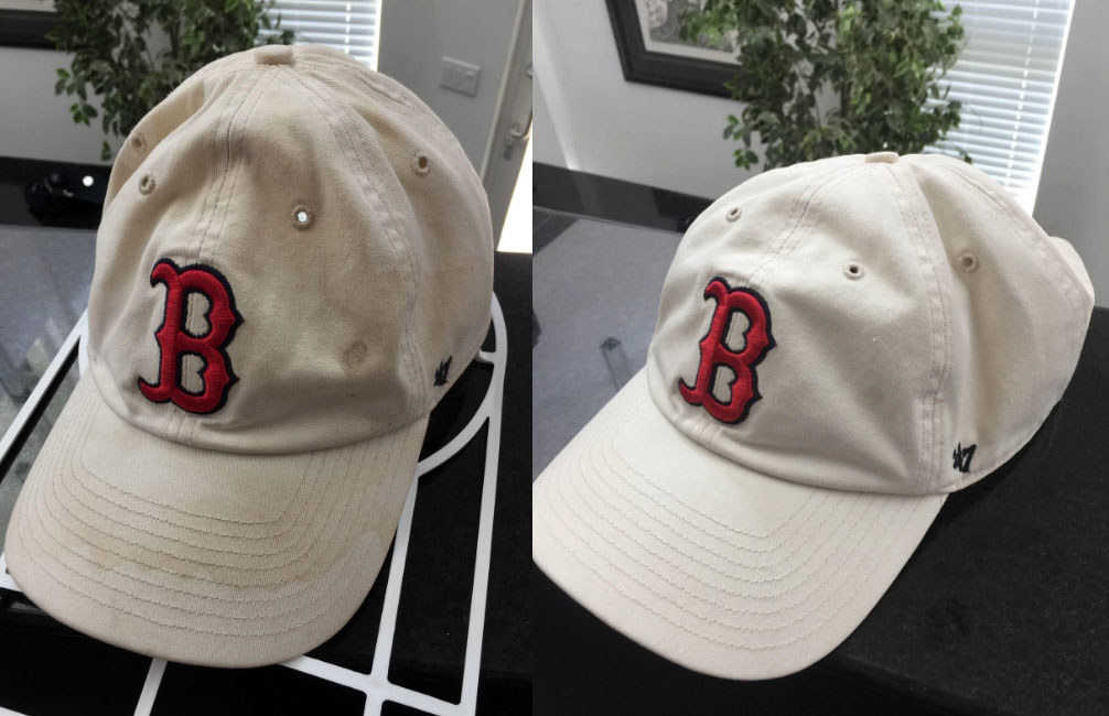 reviewer photo showing their hat completely cleaned after using the cap cage