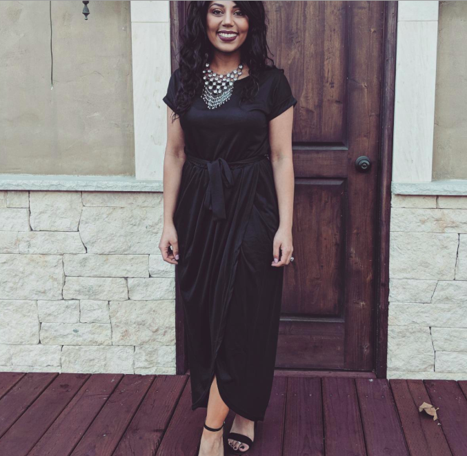 A customer review photo of them wearing the dress in black