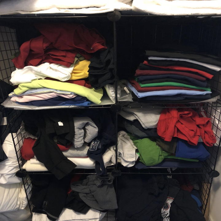 Reviewer's before picture of messy-looking tops in closet