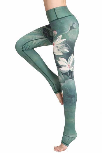The leggings in a white floral and green hue