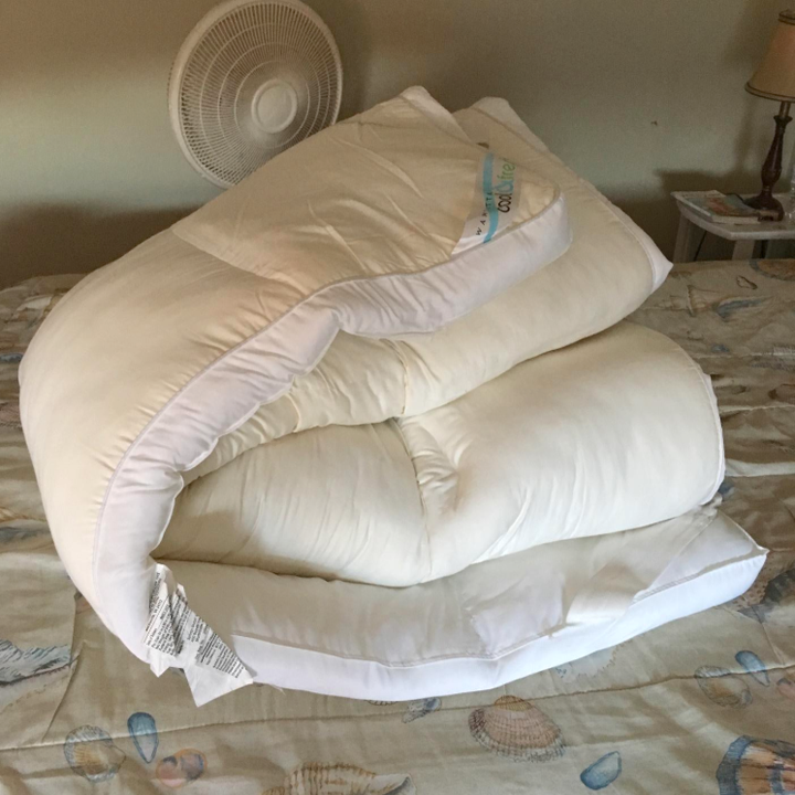 before: a really bulky duvet folded up on a bed