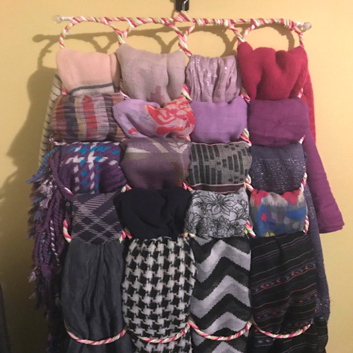the organizer with scarves tucked and hung on it