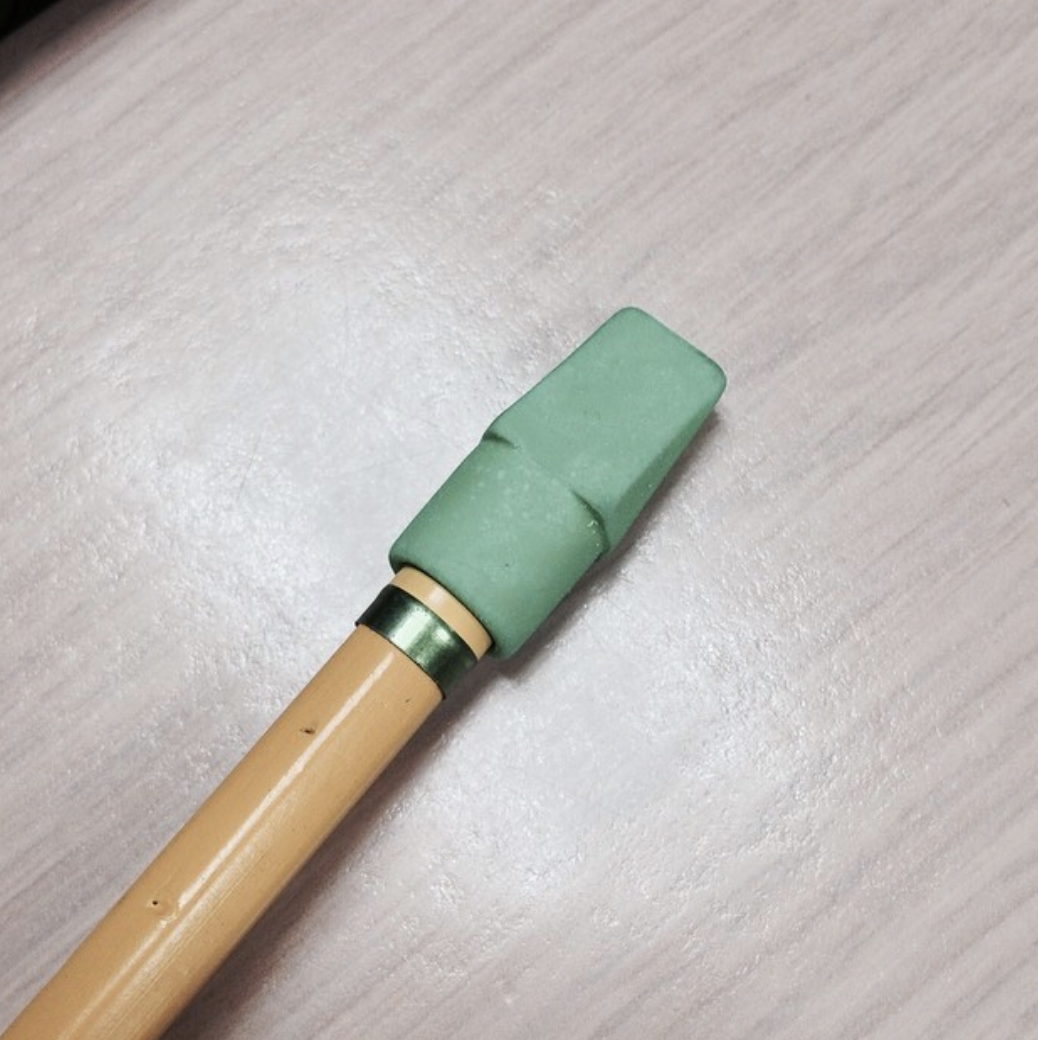 The pencil with the green cap was for science class, the one with the red cap was for math, and the one with the pink cap was for English.