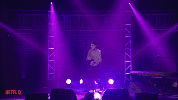 Bo Burnham doing a silly dance and seemingly turning off the lights with a simple finger twitch