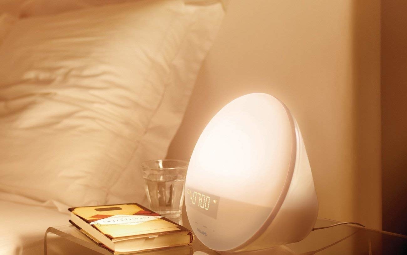 A wakeup light turning on on bedside table 