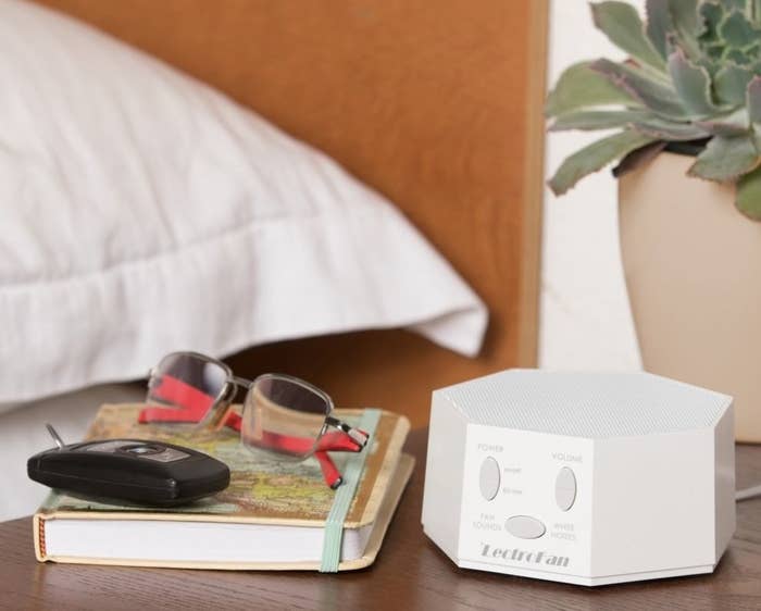 the white noise machine on an end table 