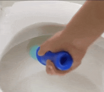 Gif of a hand stamping the gel in a toilet, the toilet flushing, and arrows showing how the gel is able to clean the bowl