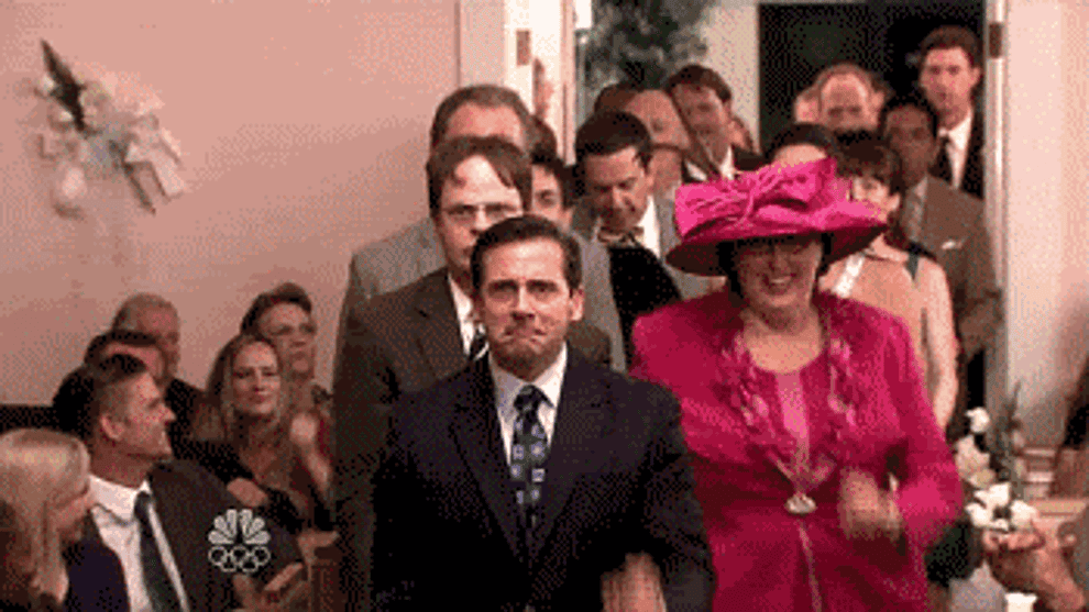 Gif of The Office cast dancing down the wedding aisle 