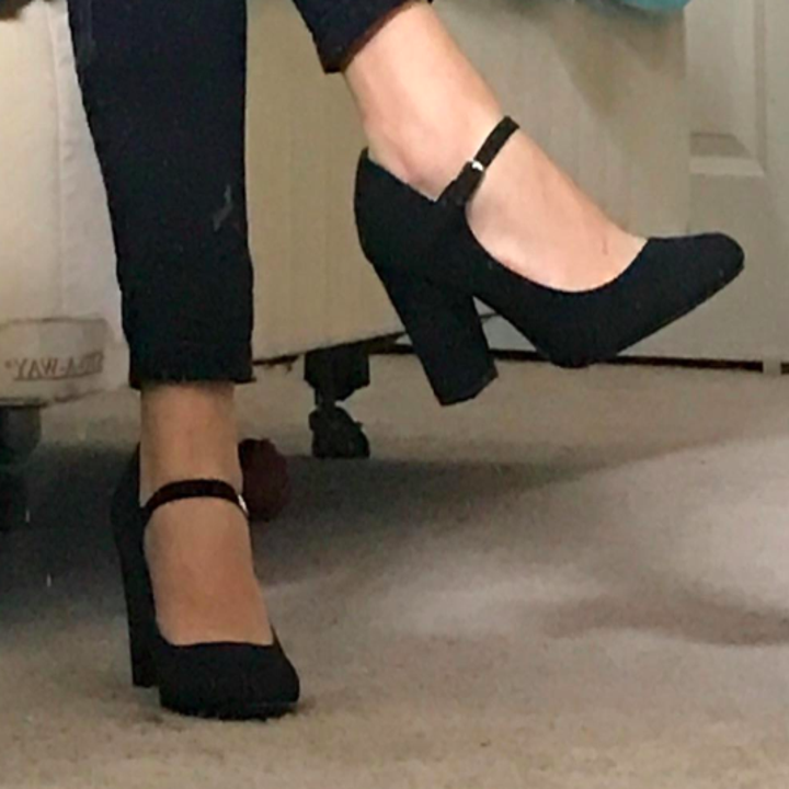 A customer review photo of a person wearing the Mary Jane heels in black