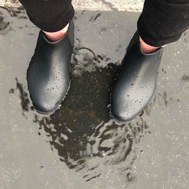 A customer review photo of the Chelsea booties in a puddle