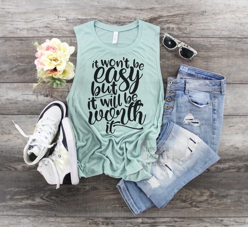 a light blue tank top with the words "it won't be easy but it will be worth it" on it blue font