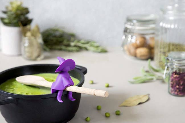 clip on spoon rest holder that looks like witch riding broomstick 