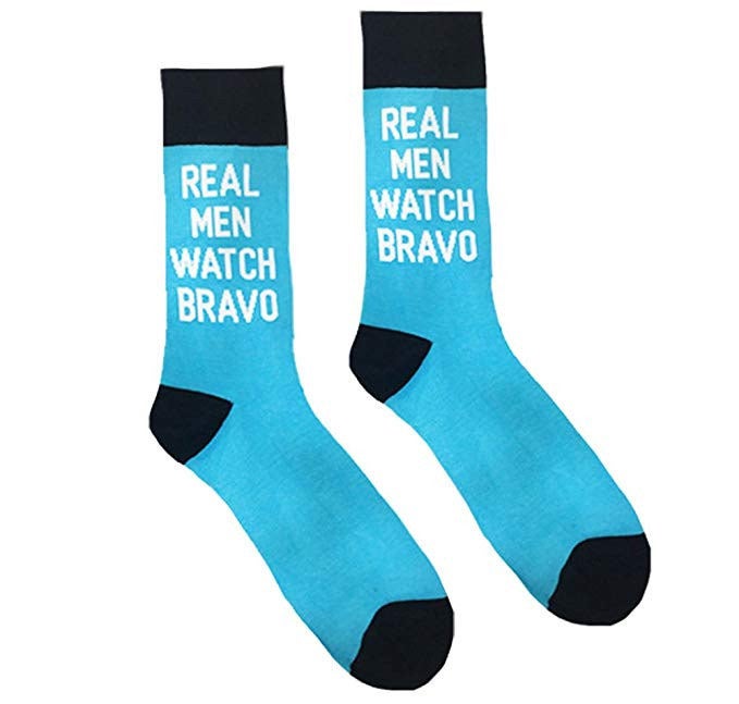blue socks that say "real men watch bravo"