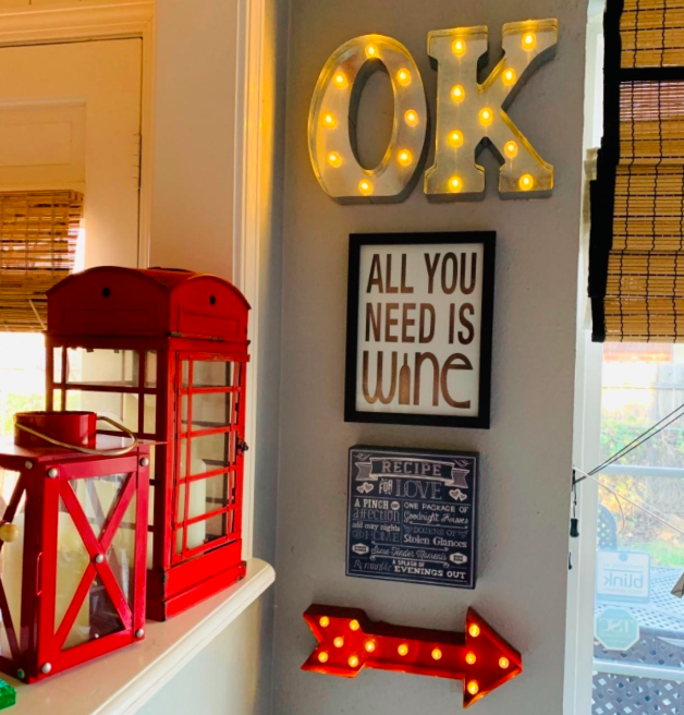 A customer review photo of the marquee letters spelling out OK on their wall.