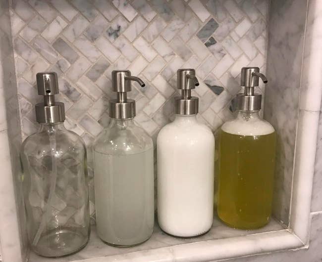 A reviewer's four soap dispensers in their shower