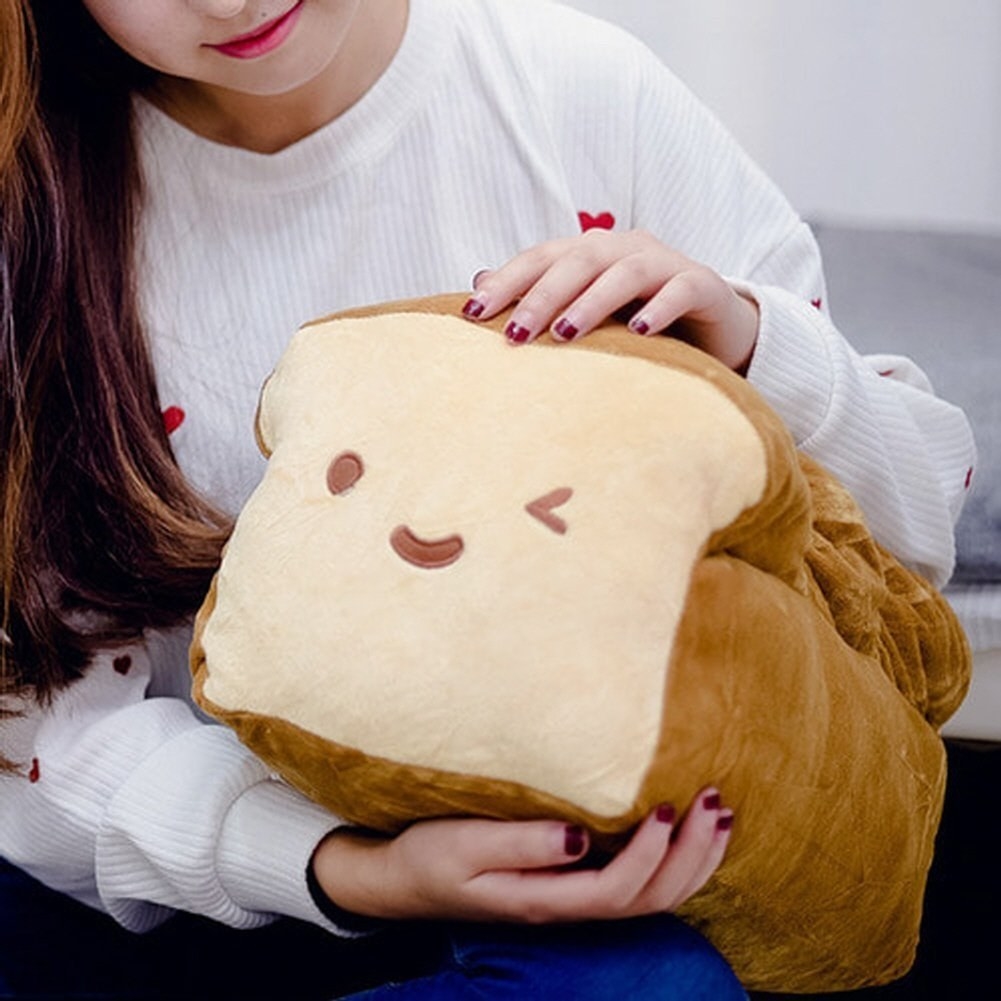 A person holding the loaf pillow