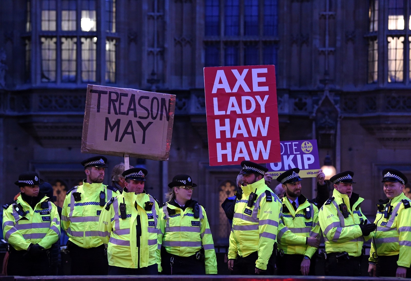 Police officers and protesters outside the Houses of Parliament.