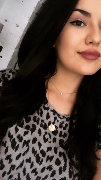 BuzzFeeder Kayla wearing two minimalist necklaces, one short and one long