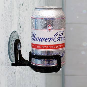 a beer held up with the holder in the shower