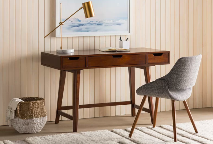 Promising review: "I really like this desk. It's very sturdy, and like other review noted, there is a beautiful vector design on the wood. The drawers in the desk are also very sturdy and run smoothly. It's a well-made desk. I would highly recommend putting this together with help, I did one by myself and it was difficult to do." —JulieGet it from AllModern for $226.80 (originally $495.99).