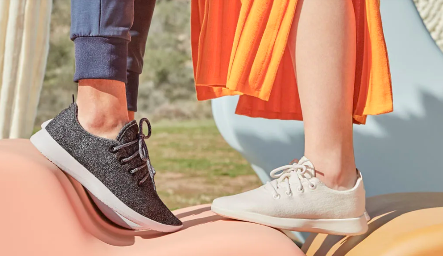 Two people wearing the shoes in different colors. The fabric is soft and the shoes go well below the ankle with high tongues and thick laces.