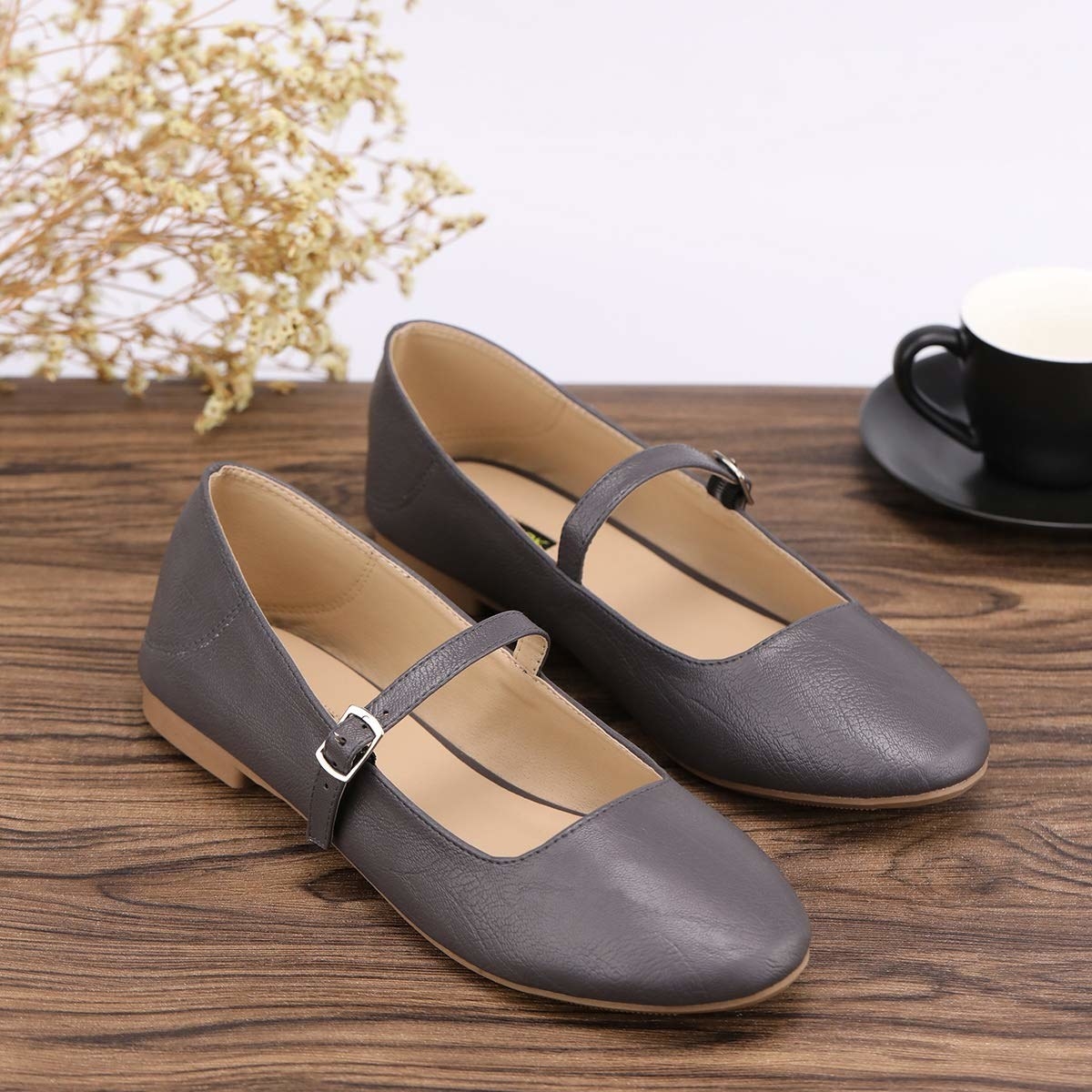 Simple Mary Janes with a round toe and a silver buckle and strap detail 