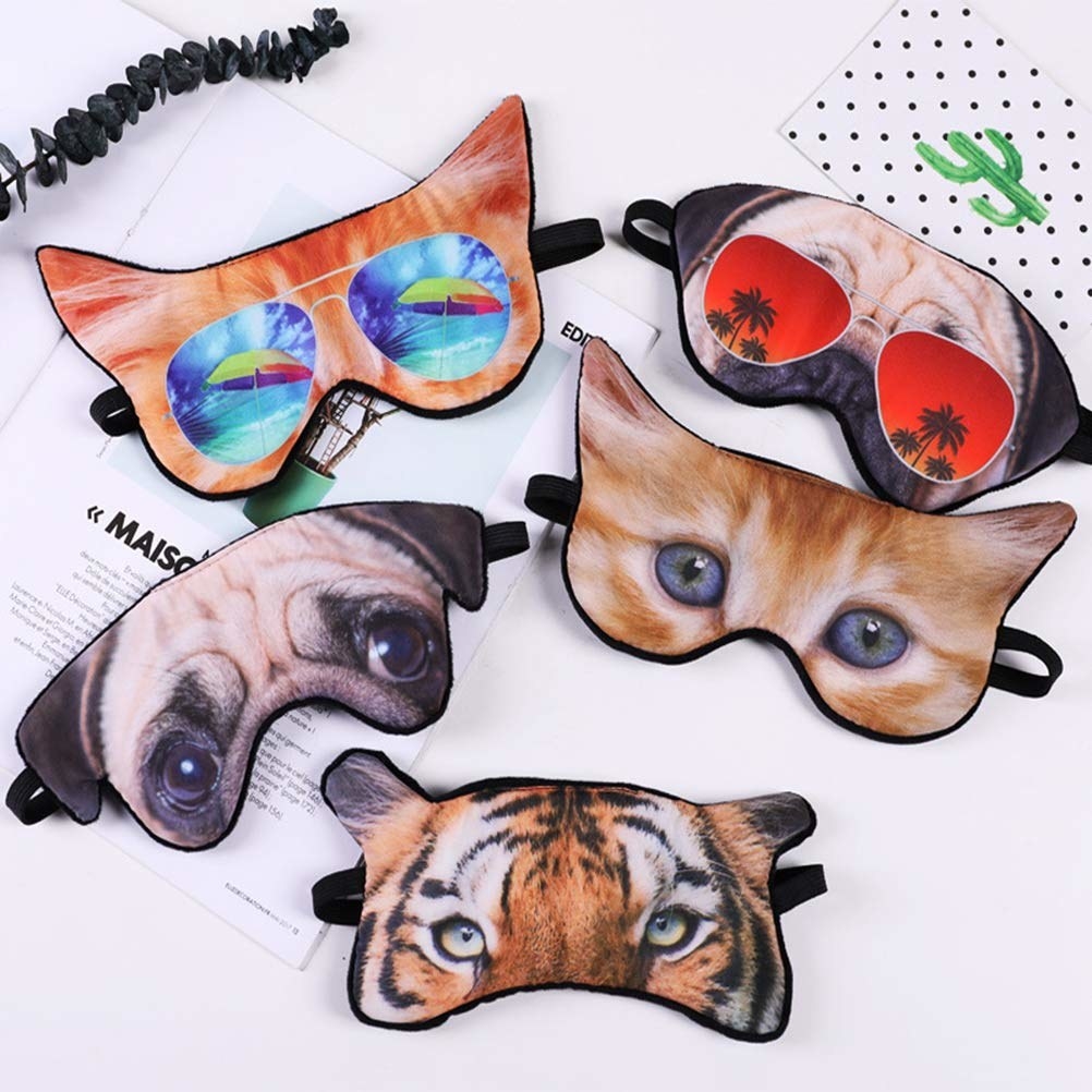 The sleep masks in multiple animal face designs, like pug, tiger, and cat
