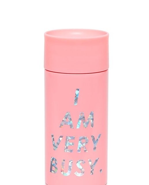 pink tumbler with the words &quot;i am very busy&quot; on it
