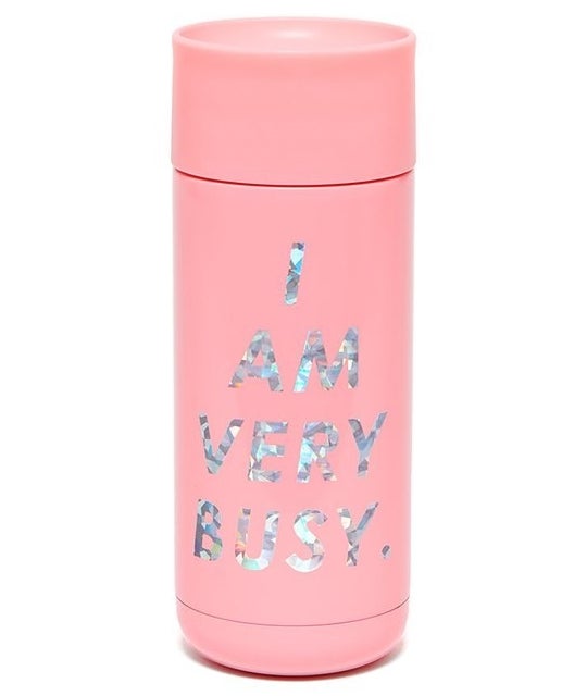 pink tumbler with the words &quot;i am very busy&quot; on it