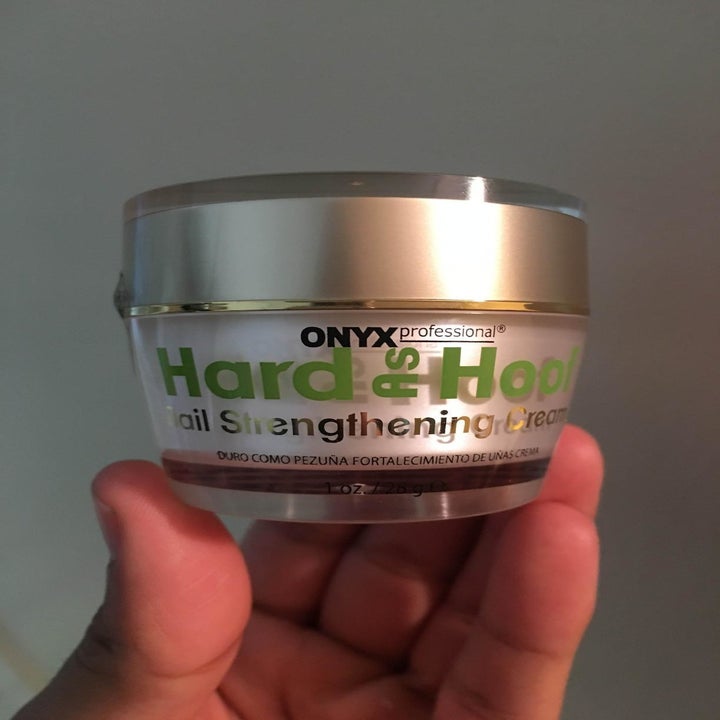 reviewer holding pot of product