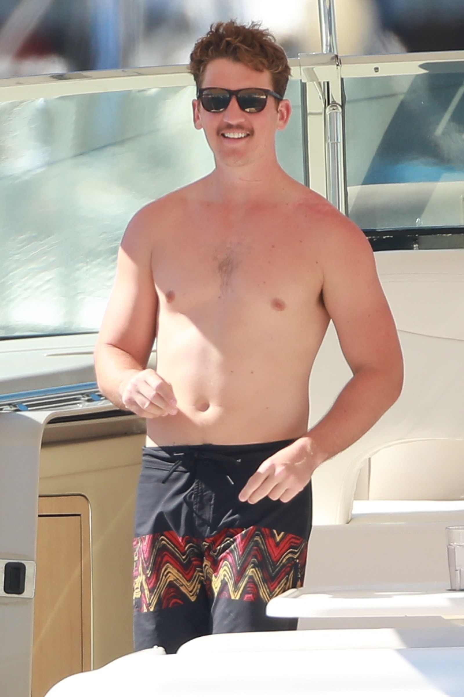 6. Miles Teller was on a yacht. 