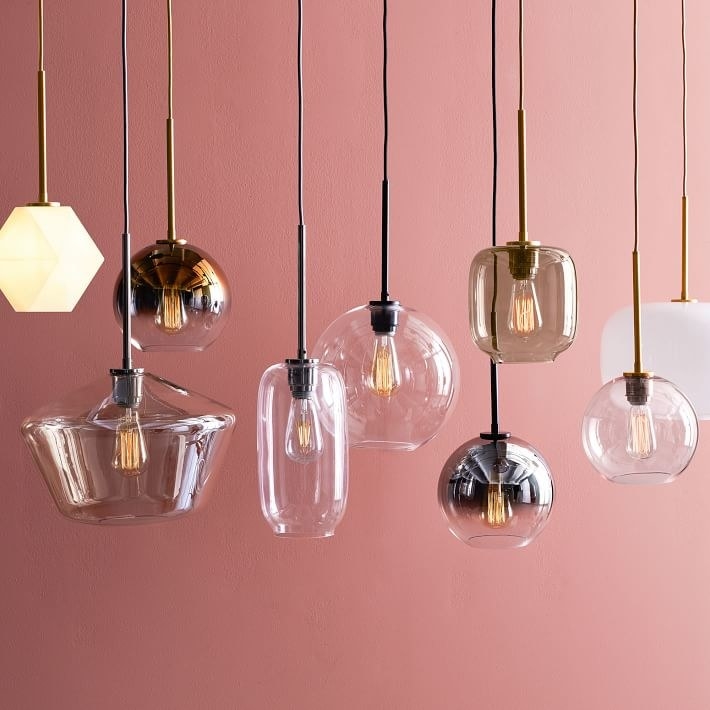 many glass pendant lights hanging