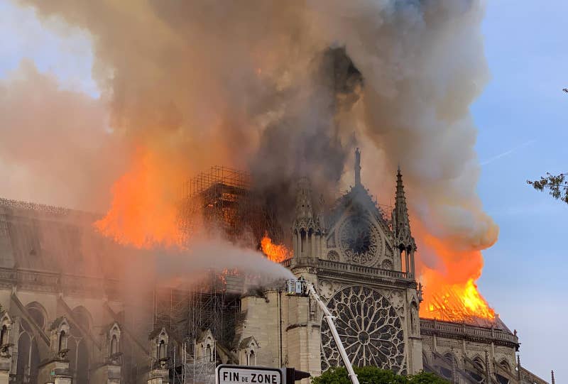 Flames and smoke are seen billowing from the roof at Notre-Dame Cathedral in Paris on April 15, 2019.