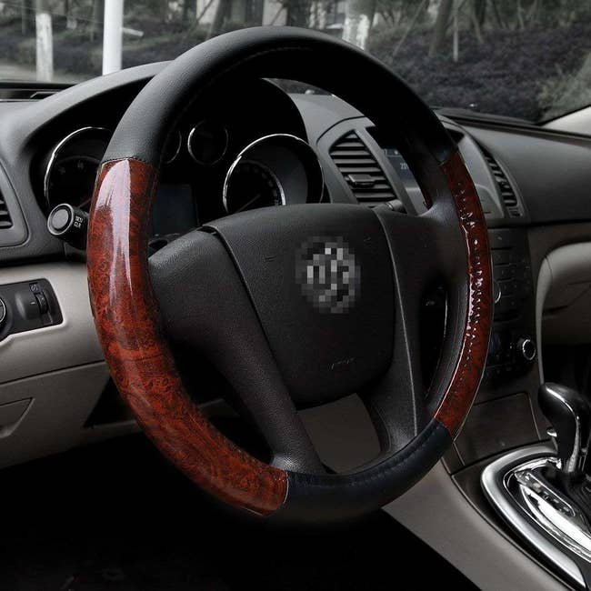 A steering wheel with the wood grain cover
