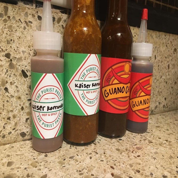 reviewer's hot sauces with custom labels 