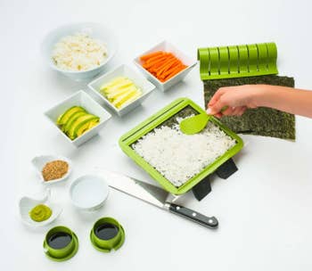 sushi kit with spatula, cutting guide, and ingredient cups
