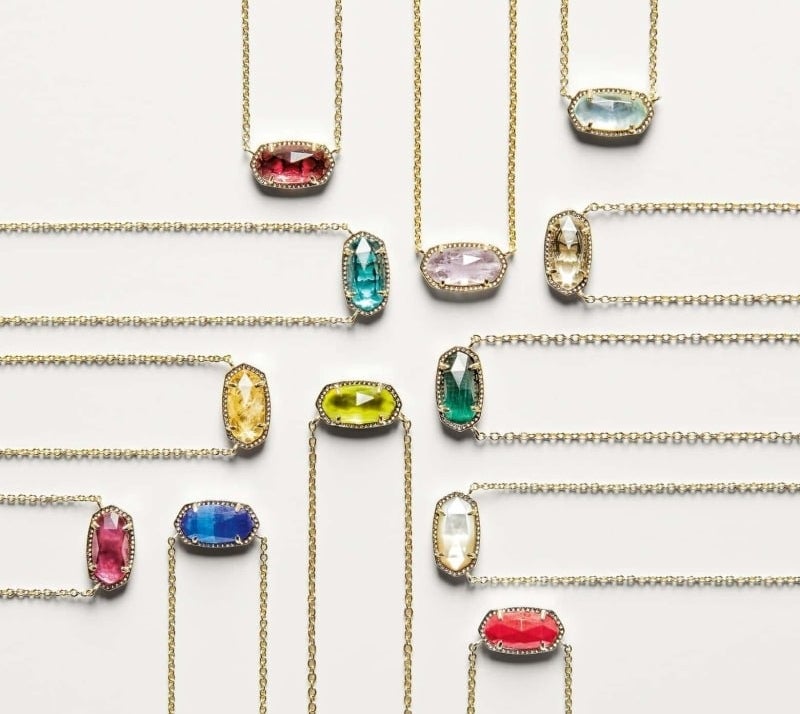 Twelves oval-shaped pendents in different-colored stones on cold chains