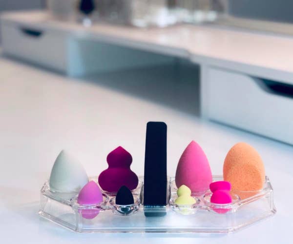 A customer review photo of the acrylic makeup sponge organizer. 