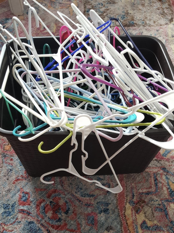 reviewer image of a bunch of tangled hangers in a bin