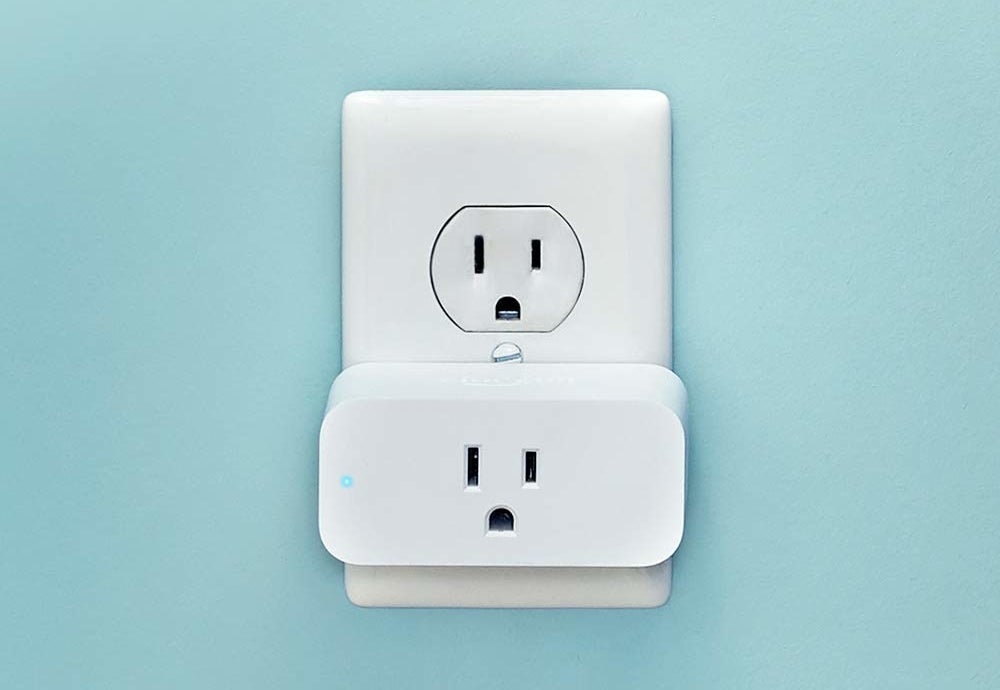 A white rectangle plug in a wall outlet