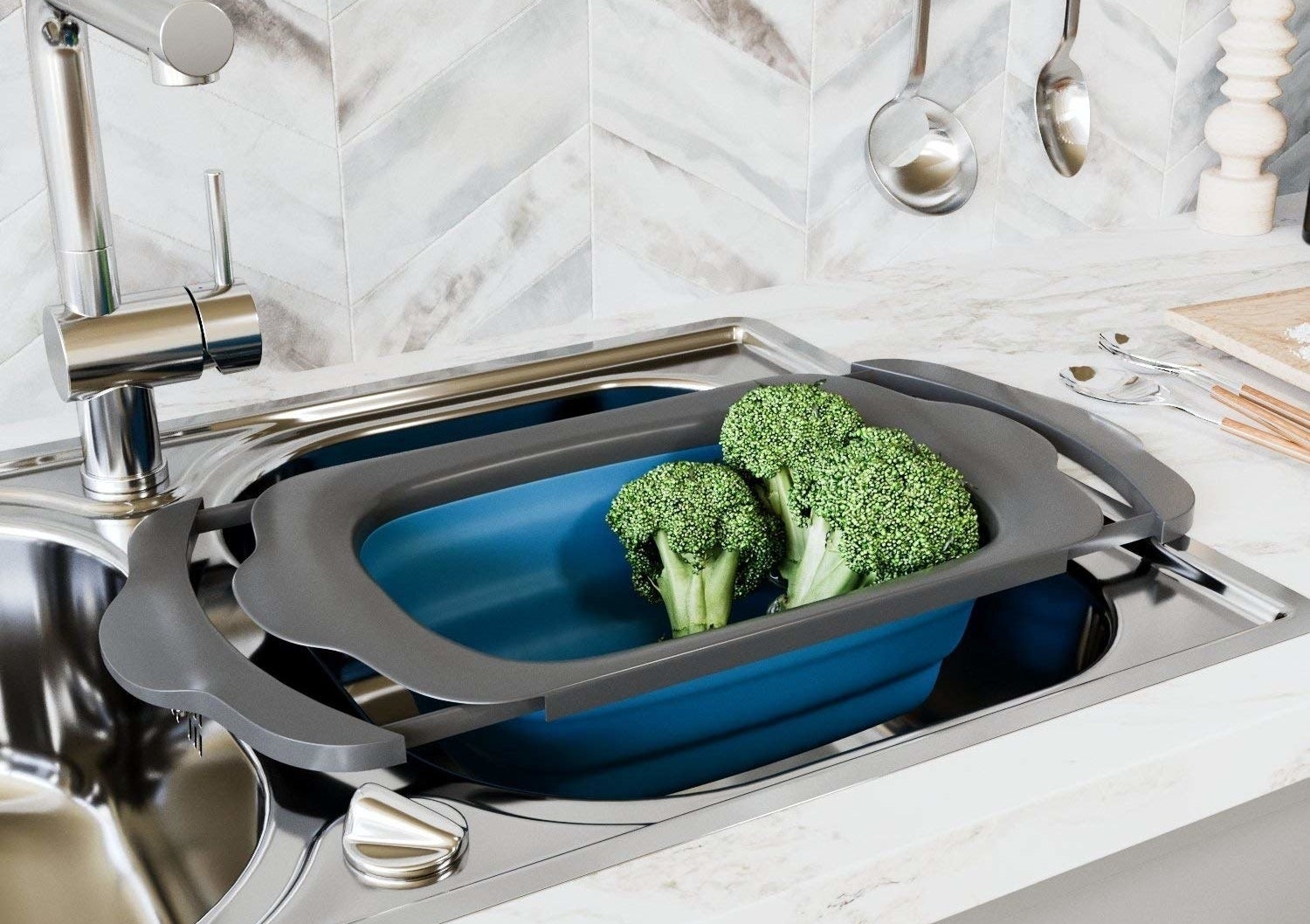 extendable colander inside sink with veggies