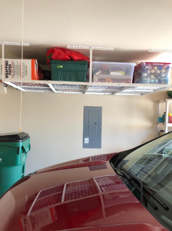 Reviewer overhead storage rack in garage
