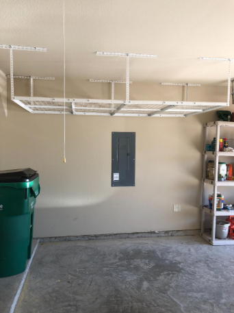 Reviewer overhead storage rack in garage