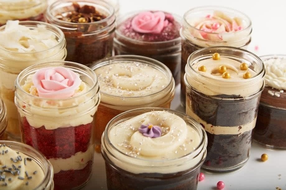 assortment of cupcakes in jars