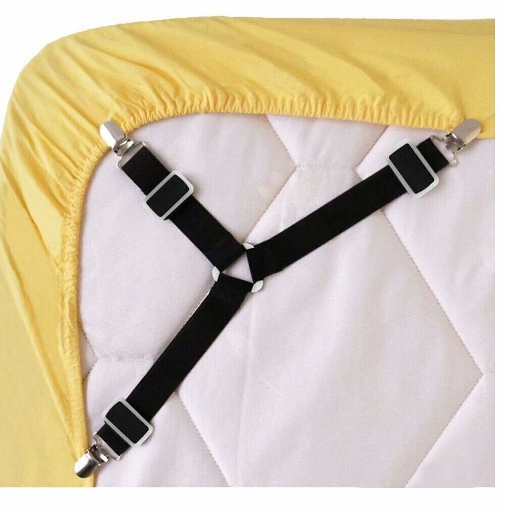 The three-armed strap, which looks like suspenders, clipped to the underside corner of a fitted sheet around a mattress