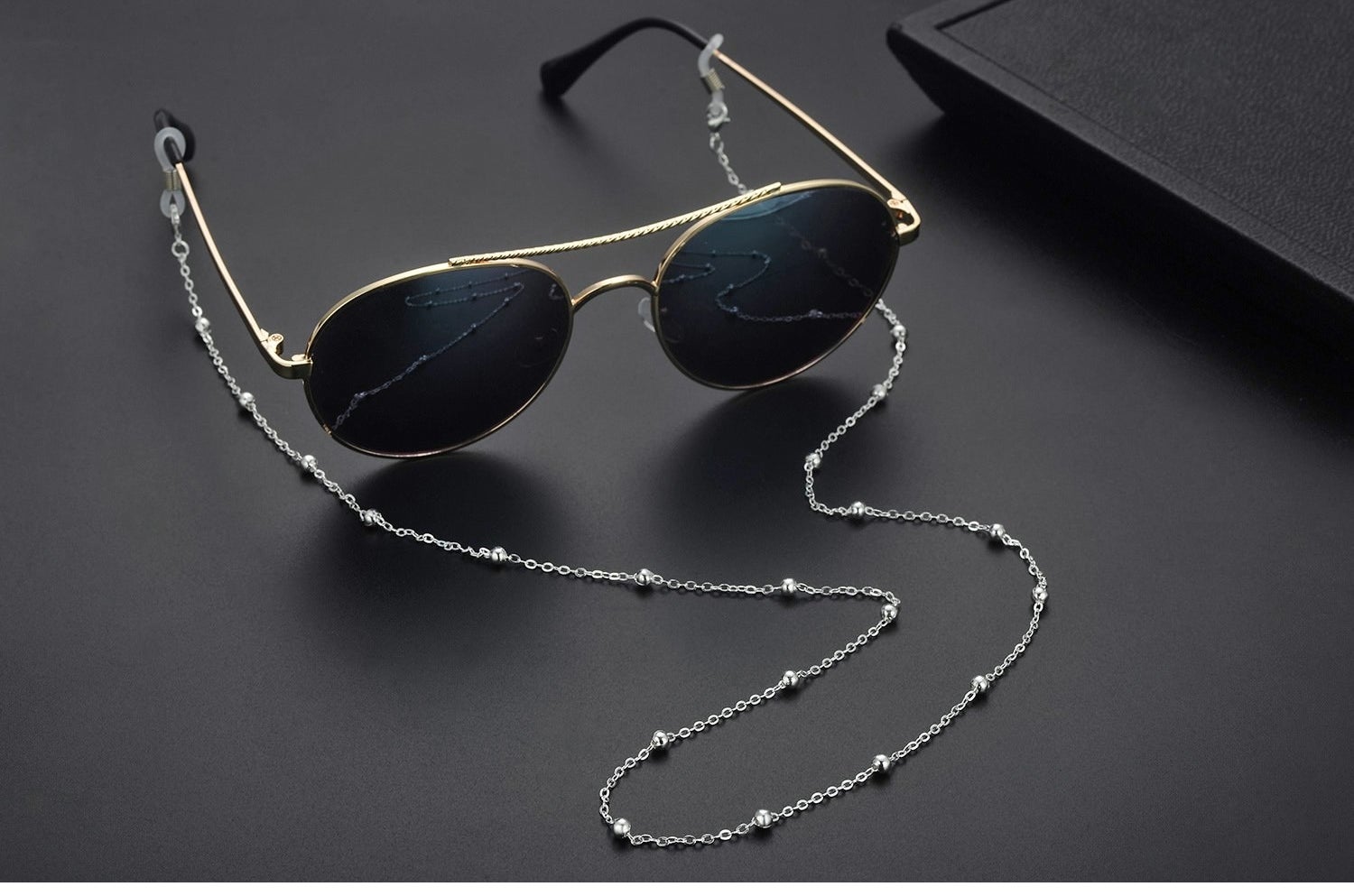 Sunglasses with the chain attached to the arms