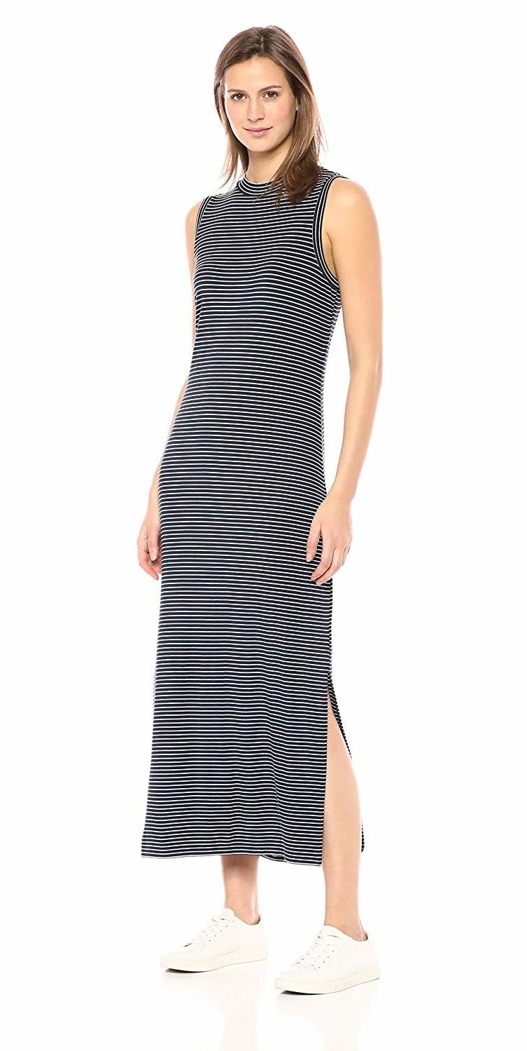 model wearing striped high-neck midi dress with slit