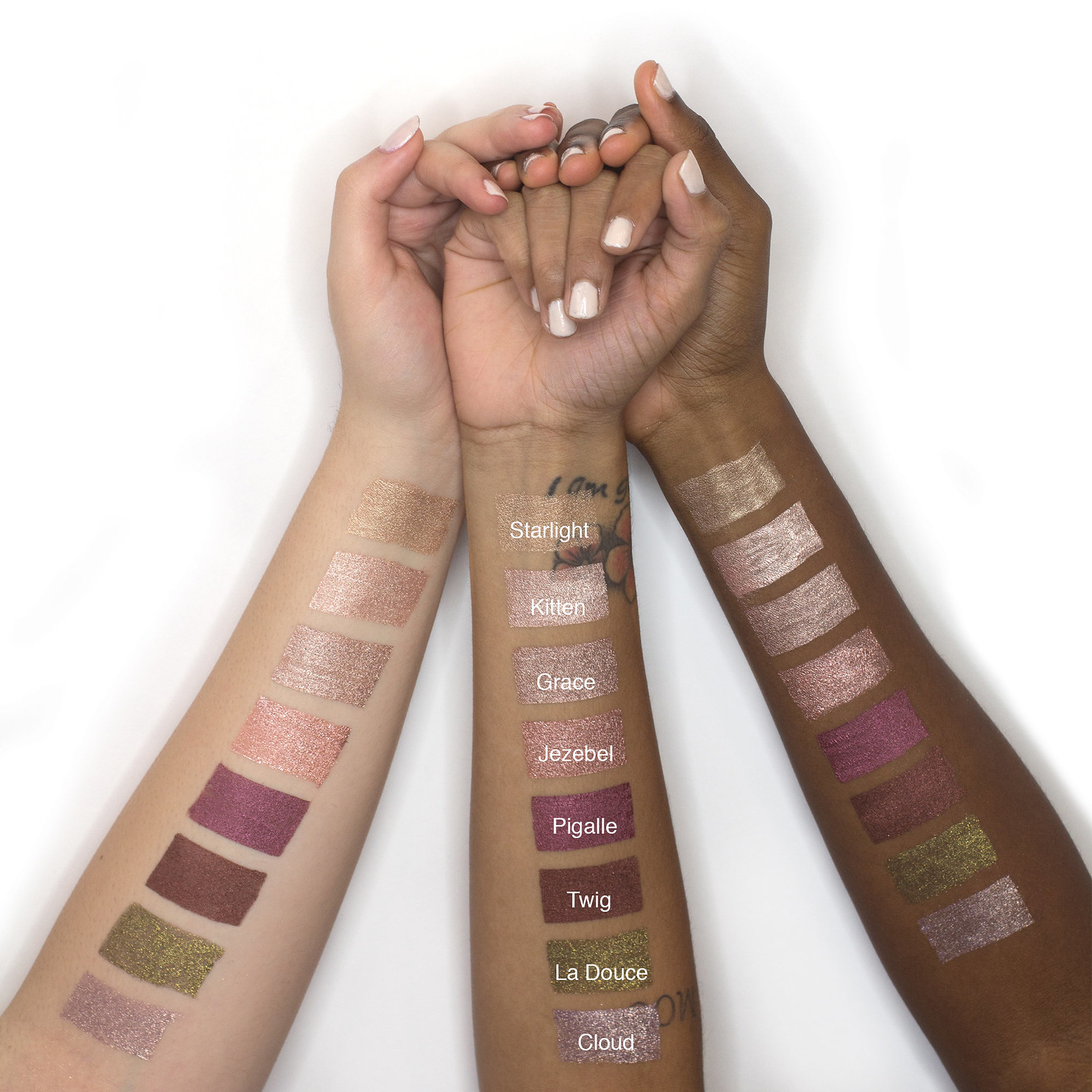 Three arms with different skin tones showing swatches of eight colors, including gold, rose gold, purples, and greens