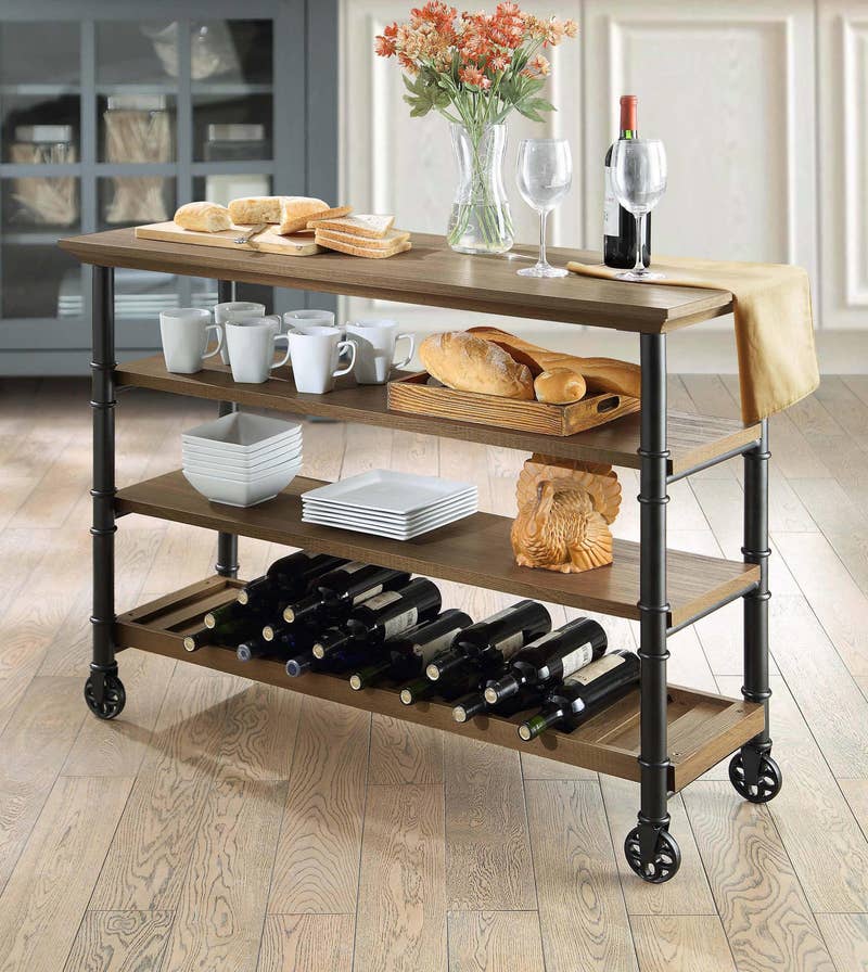 Promising review: "I have two of these and bought them specifically to help free up some of the cabinet space in my kitchen and to store wine. It is a solid, quality piece of furniture and adds a nice industrial-rustic quality to the space. The finish on both the wood and metal pieces are smooth. Although the feet are circular, they are not wheels and do not move. The bottoms of the feet are actually sufficiently flat, making for a stable stand. It was quite easy to put together, taking less than 25 minutes. All-in-all, it's a great design and I couldn't be happier with it." —HoustonStrongPrice: 9